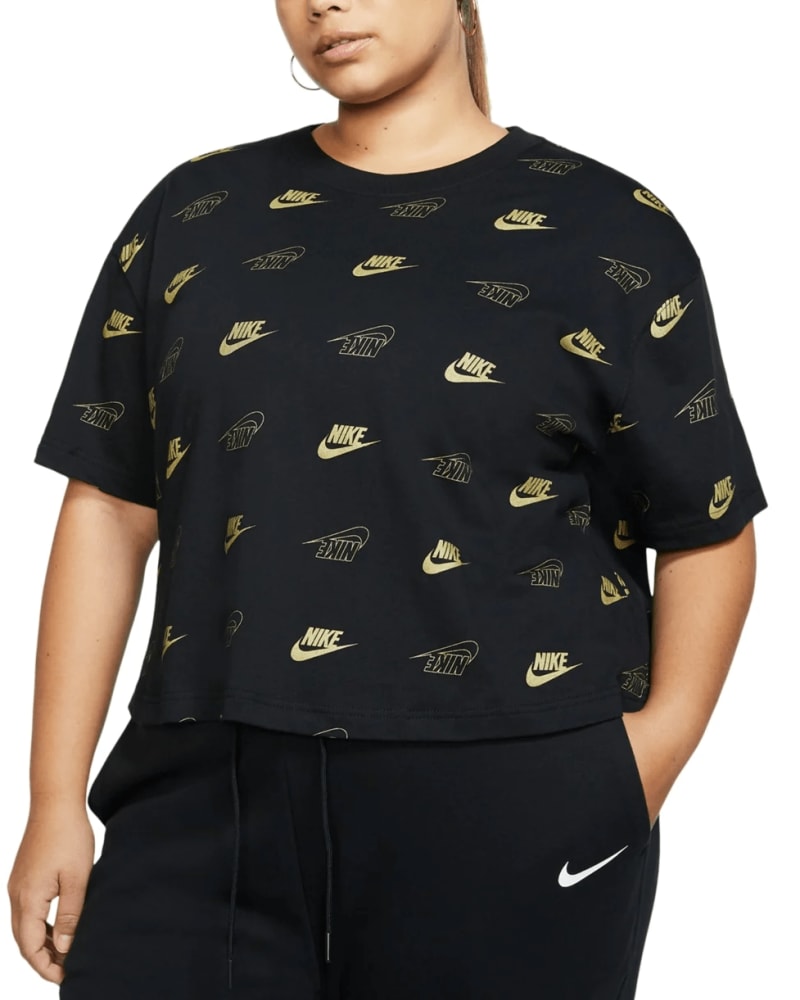 Front of a model wearing a size 1X Nike Women's Plus Workout Performance Crop Top Black Size 1X in Black by Nike. | dia_product_style_image_id:311499